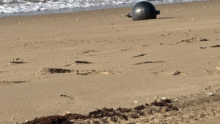 Mystery of metallic spheres on Australian beach gets explanation